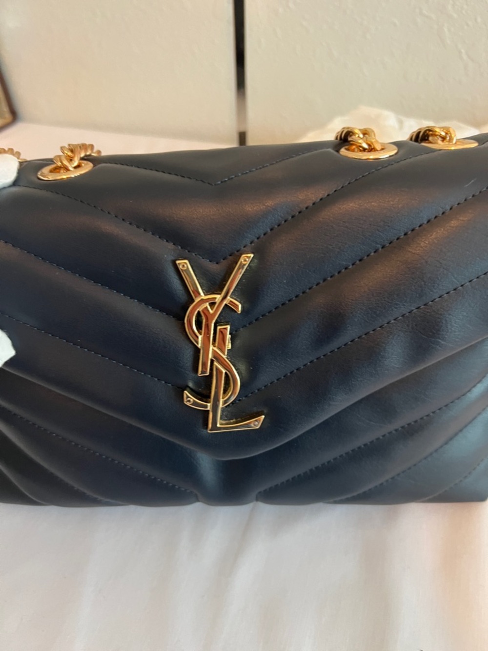 Yves Saint Laurent Navy Blue with gold tone chain and emblem. - Picture 6 of 11